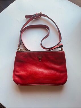 BACI Orange Leather Crossbody Bag with Heart Accent
